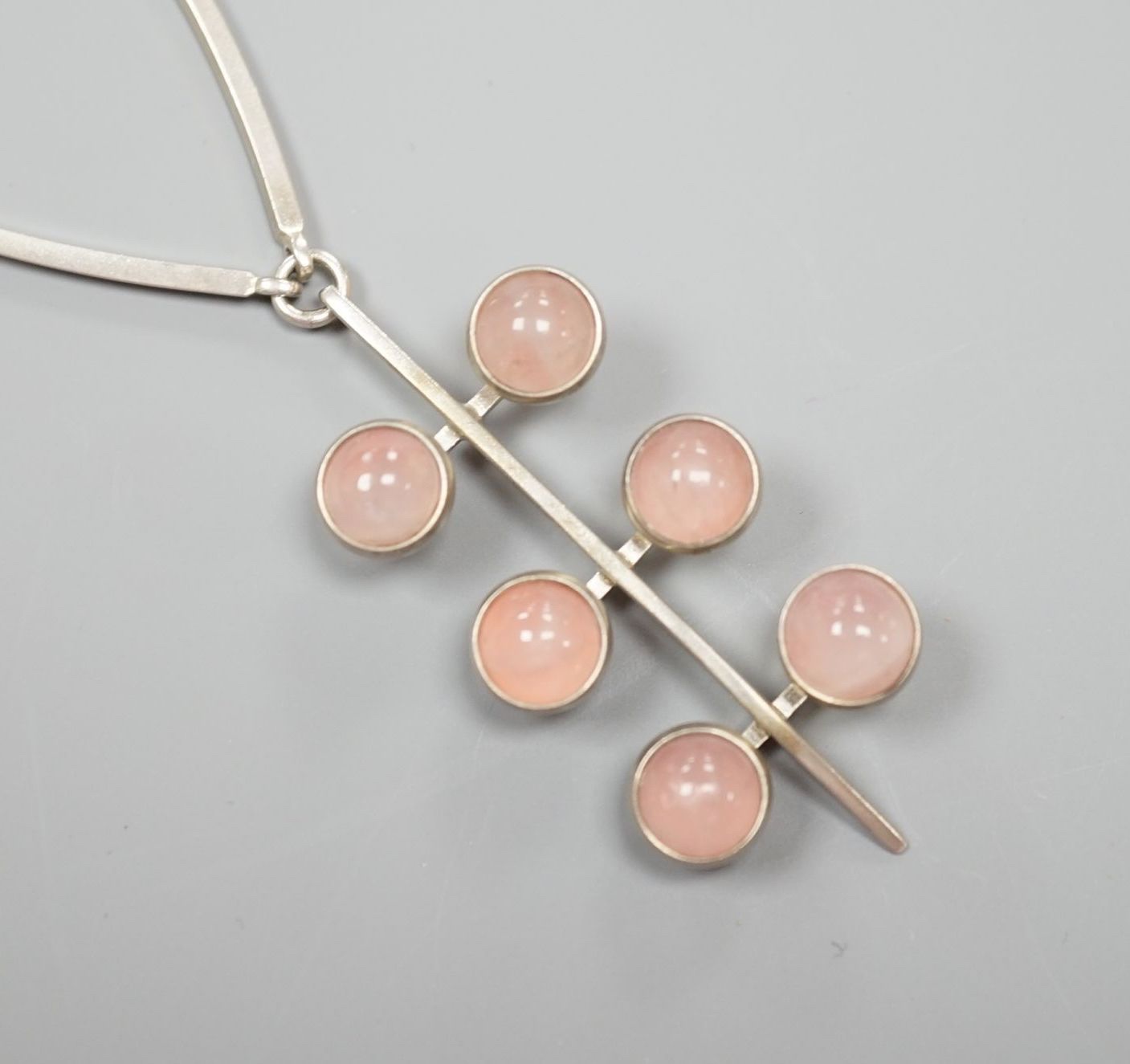 A stylish Danish 925 and rose quartz set necklace, by Niels From, stamped '925 From', 56cm.